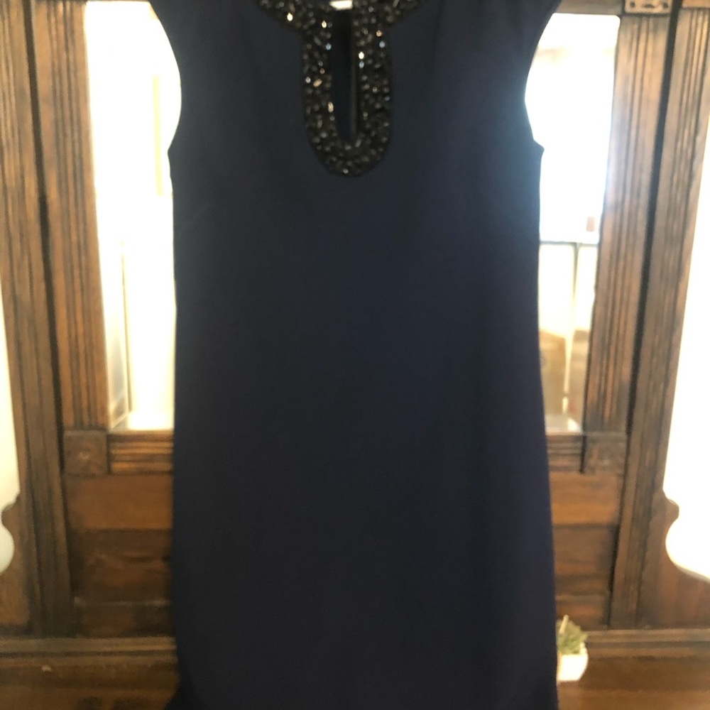 Size 6. Navy with black embellishment. Classic dress.